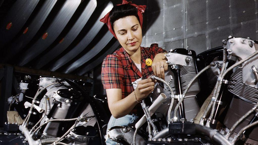 Woman working on motor